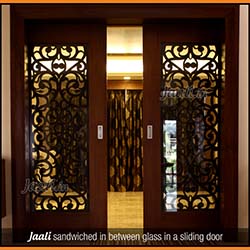 Jaali sandwiched in between glass in a sliding door copy.jpg